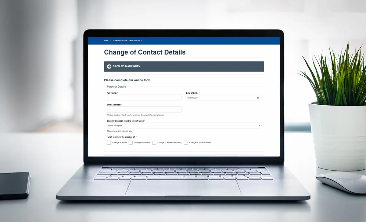 A laptop displaying the Change of Contact Details form